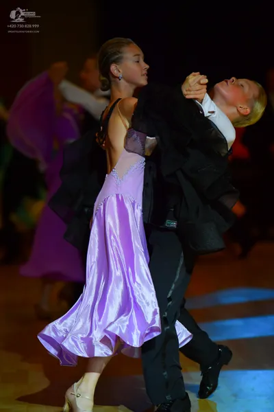 Dancesport competitor: Male dancer: black suit with a white shirt and black trousers