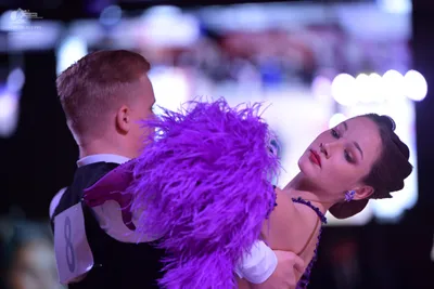 Dancesport competitor: Male dancer: black waistcoat over a white shirt with a wing collar