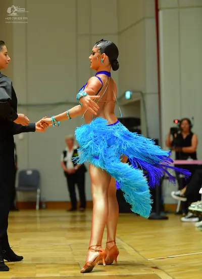 Dancesport competitor: Male dancer: black long-sleeved shirt and black trousers