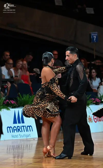 Dancesport competitor: Female dancer: leopard print Latin dress