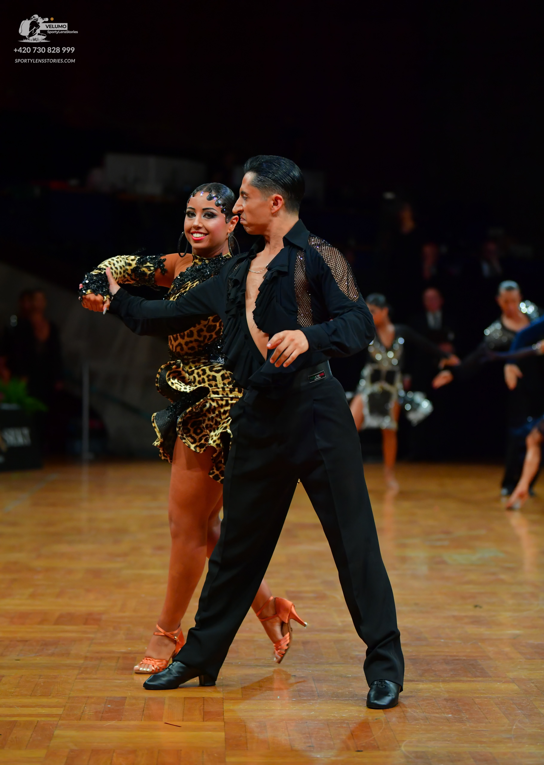 Dancesport competitor: Black sequin tail suit with a sculpted fit