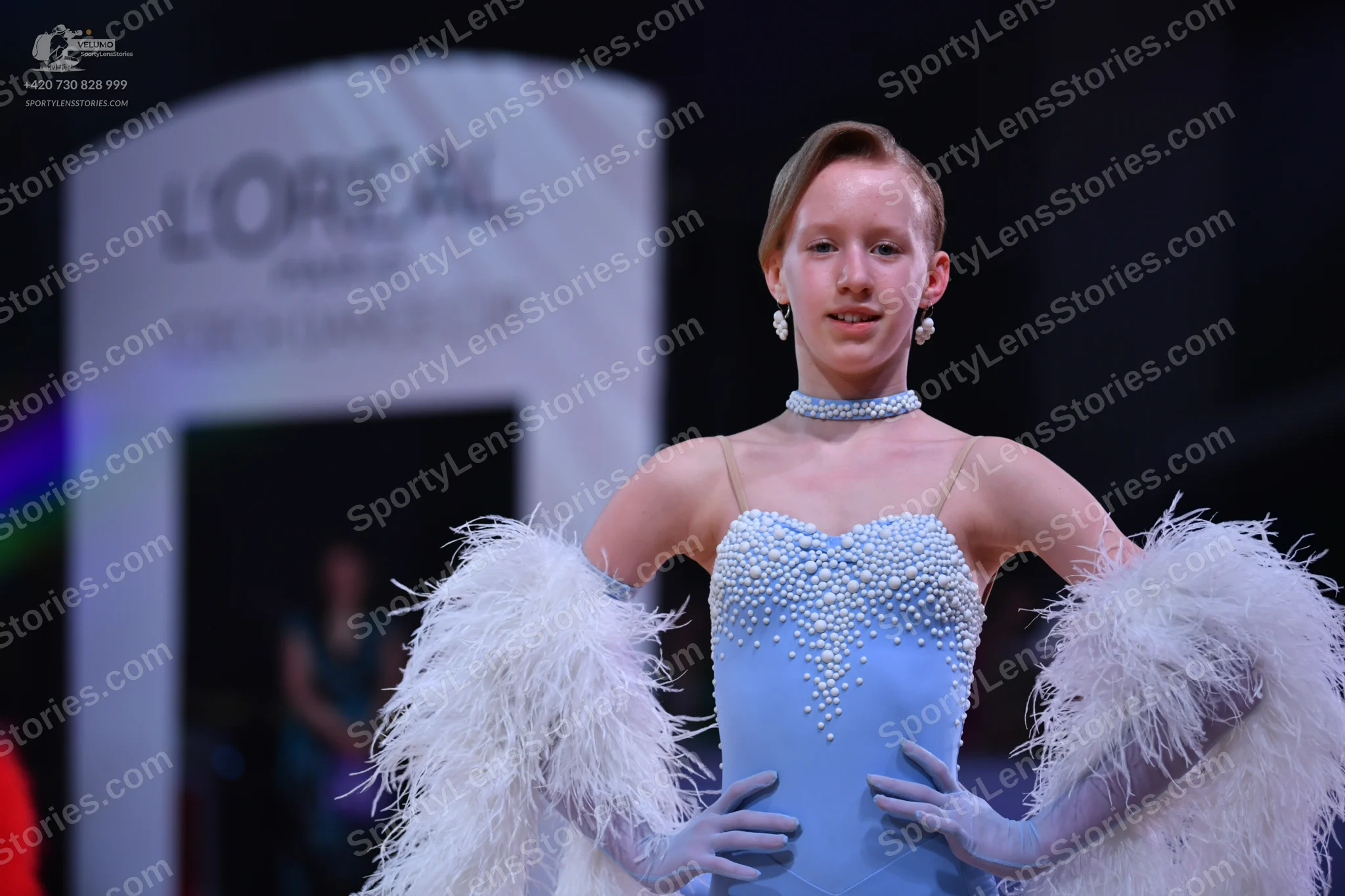 Dancesport competitor: Female dancer: light blue ballroom dress bodice with white pearl/bead embellishm