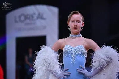Dancesport competitor: Female dancer: light blue ballroom dress bodice with white pearl/bead embellishm