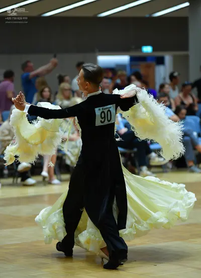 Dancesport competitor #90: Male dancer: black long-sleeved shirt and black trousers