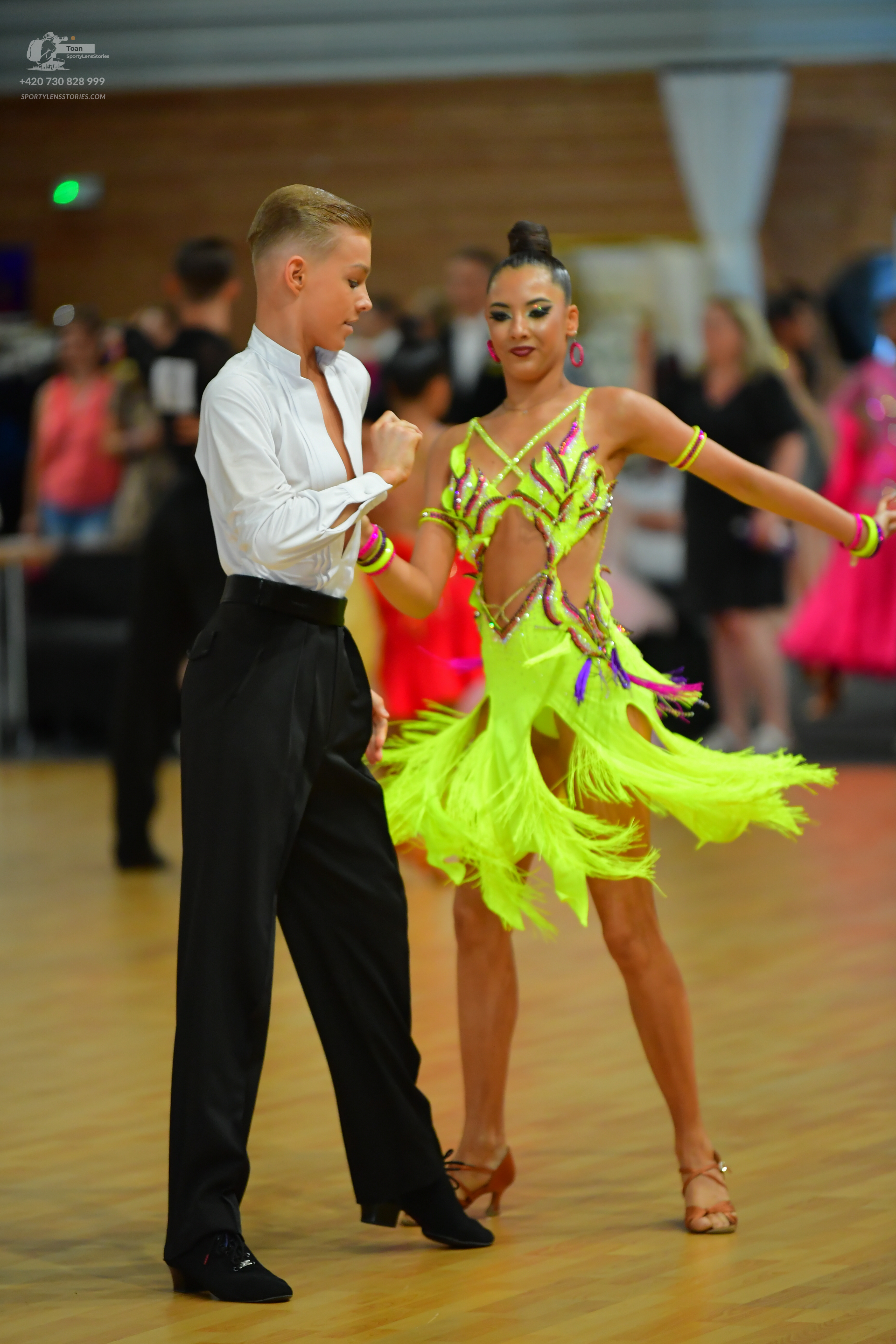 Dancesport competitor: ** Black tailsuit with a white sequin lapel