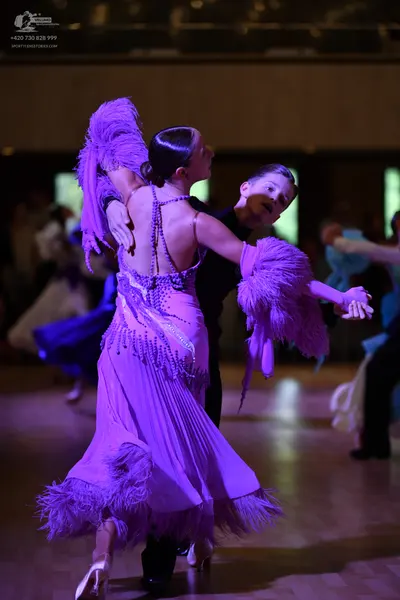 Dancesport competitor: ** Black tail suit
