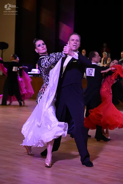 Dancesport competitor: ** Black suit with a sequined lapel detail