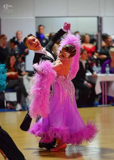 Dancesport competitor: Male dancer: black suit with a white shirt and black bow tie