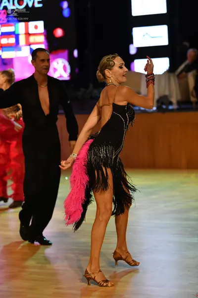 Dancesport competitor: ** Black tail suit