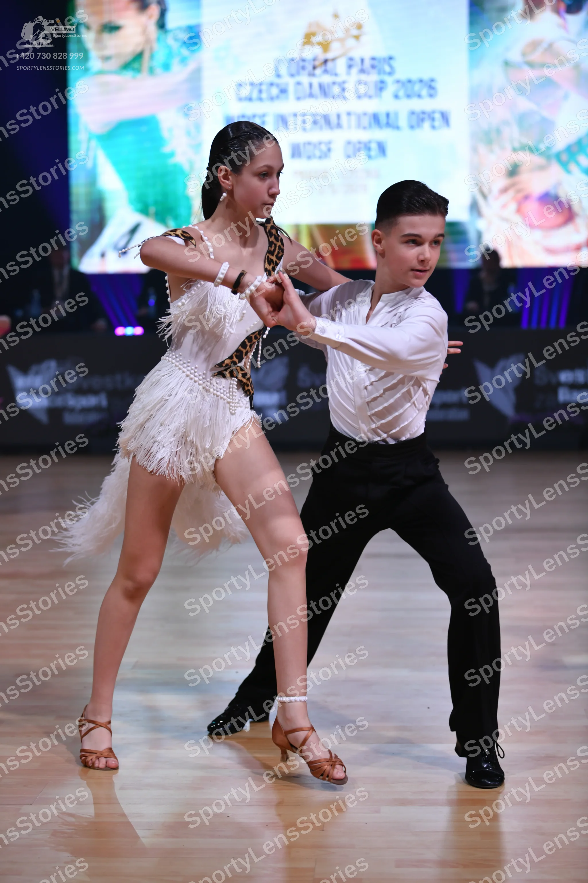 Dancesport competitor: Male dancer: white long-sleeved shirt and black trousers