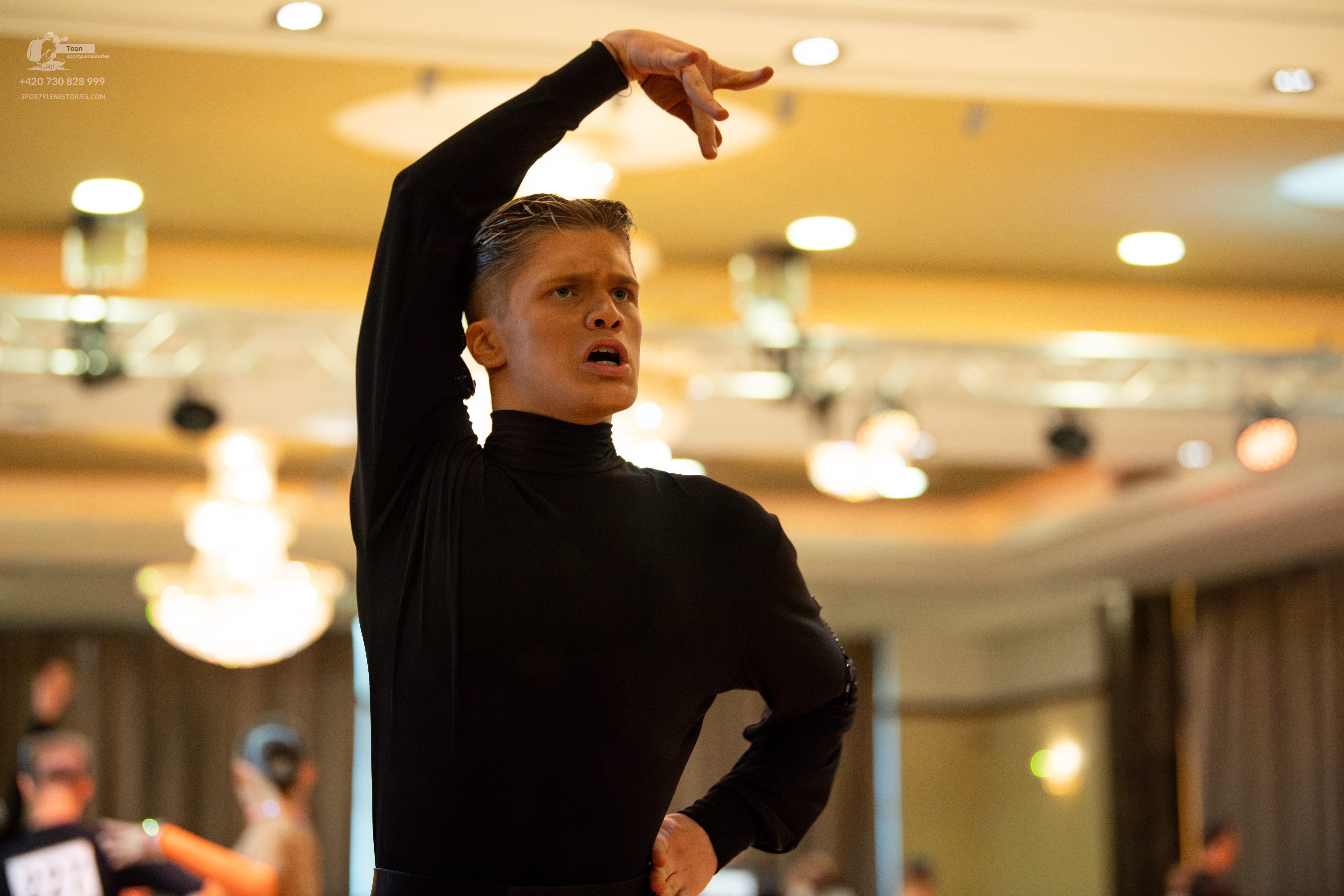 Dancesport competitor: Male dancer: black long-sleeved turtleneck
