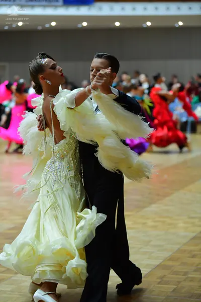 Dancesport competitor: Male dancer: black suit