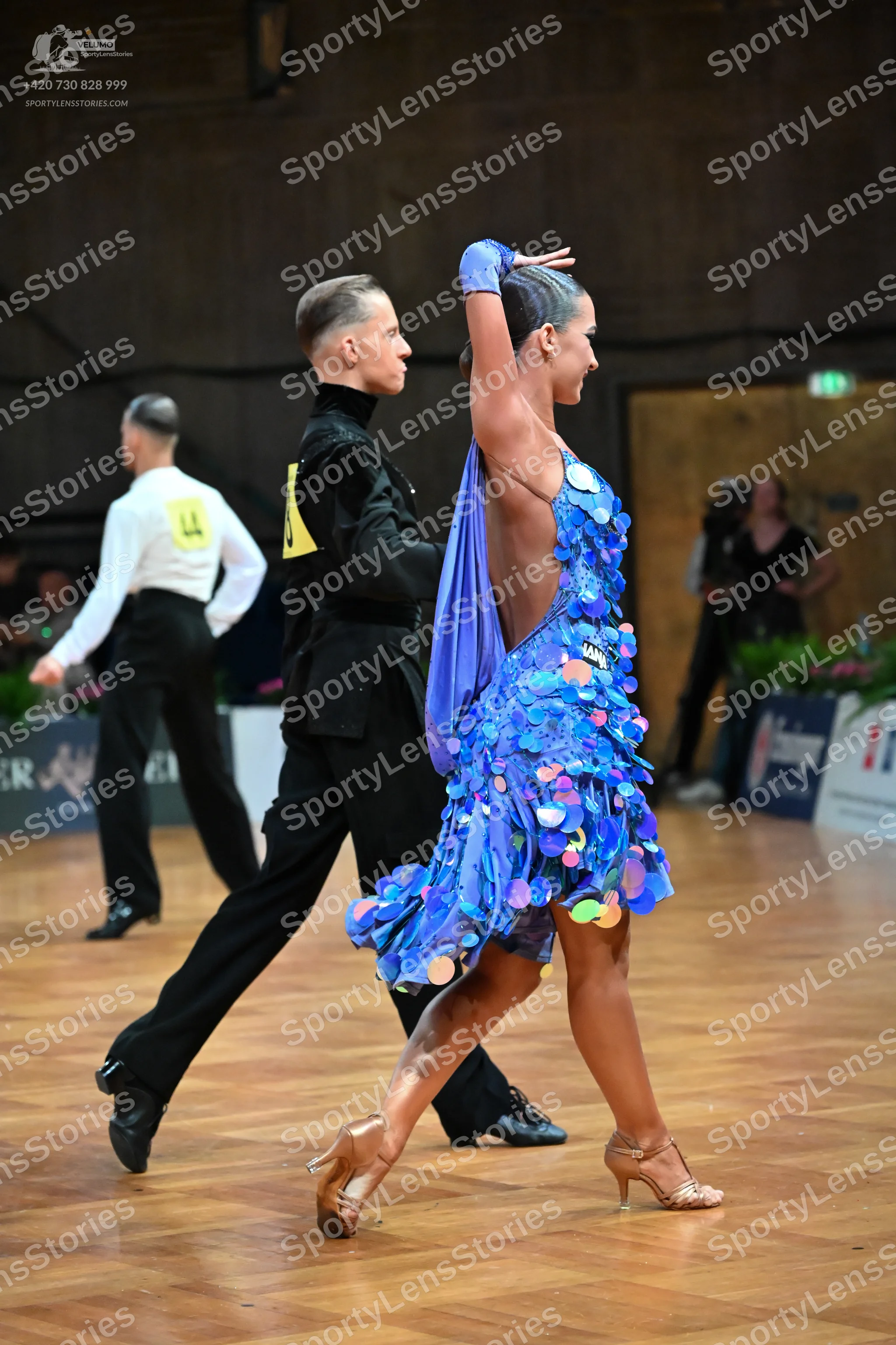 Dancesport competitor #14: Male dancer (foreground): black long-sleeved shirt and black trousers