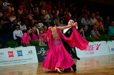 Dancesport competitor: Male dancer: black formal suit with a white shirt