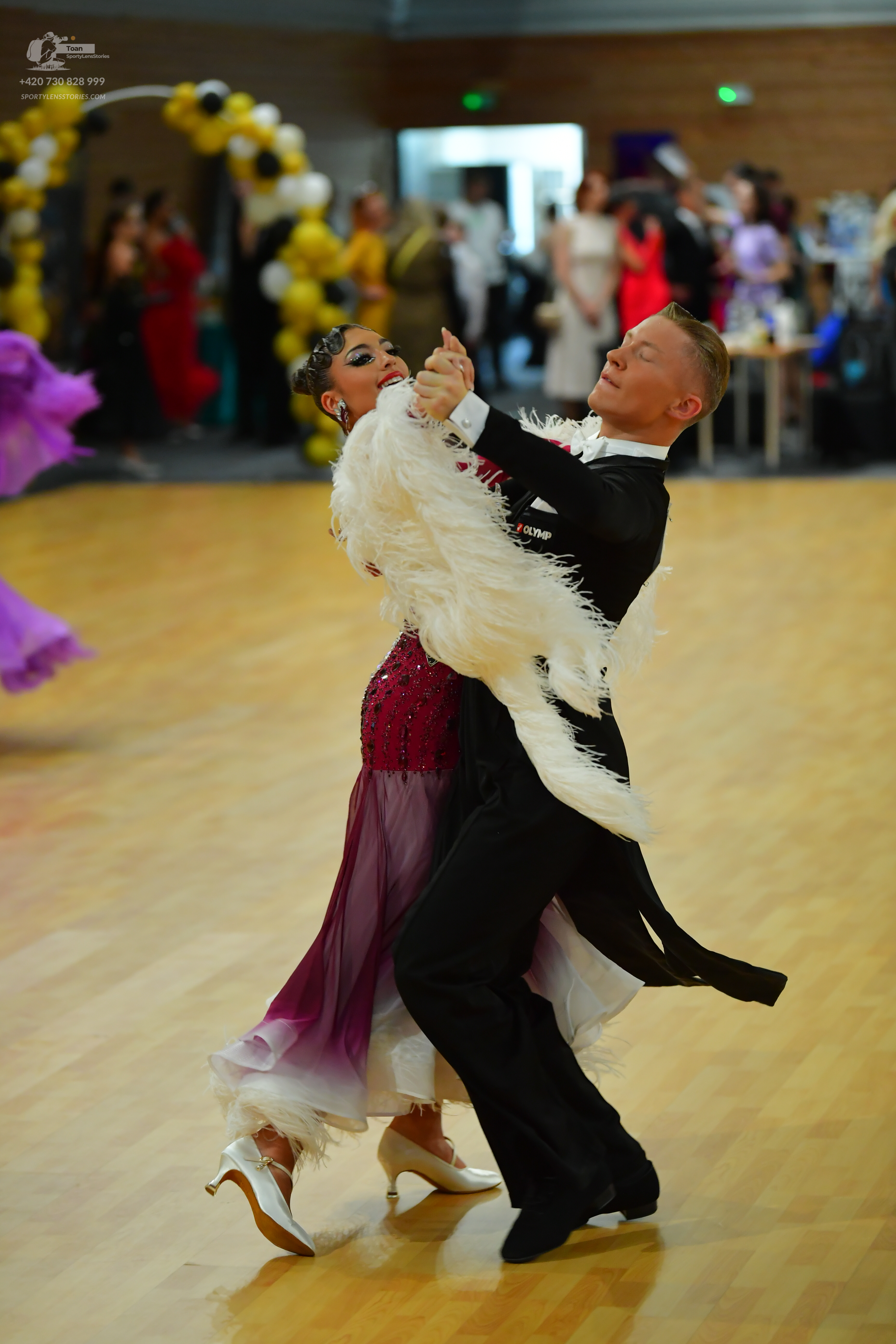 Dancesport competitor: ** Black tail suit with white sequin lapels and a slightly flared skirt