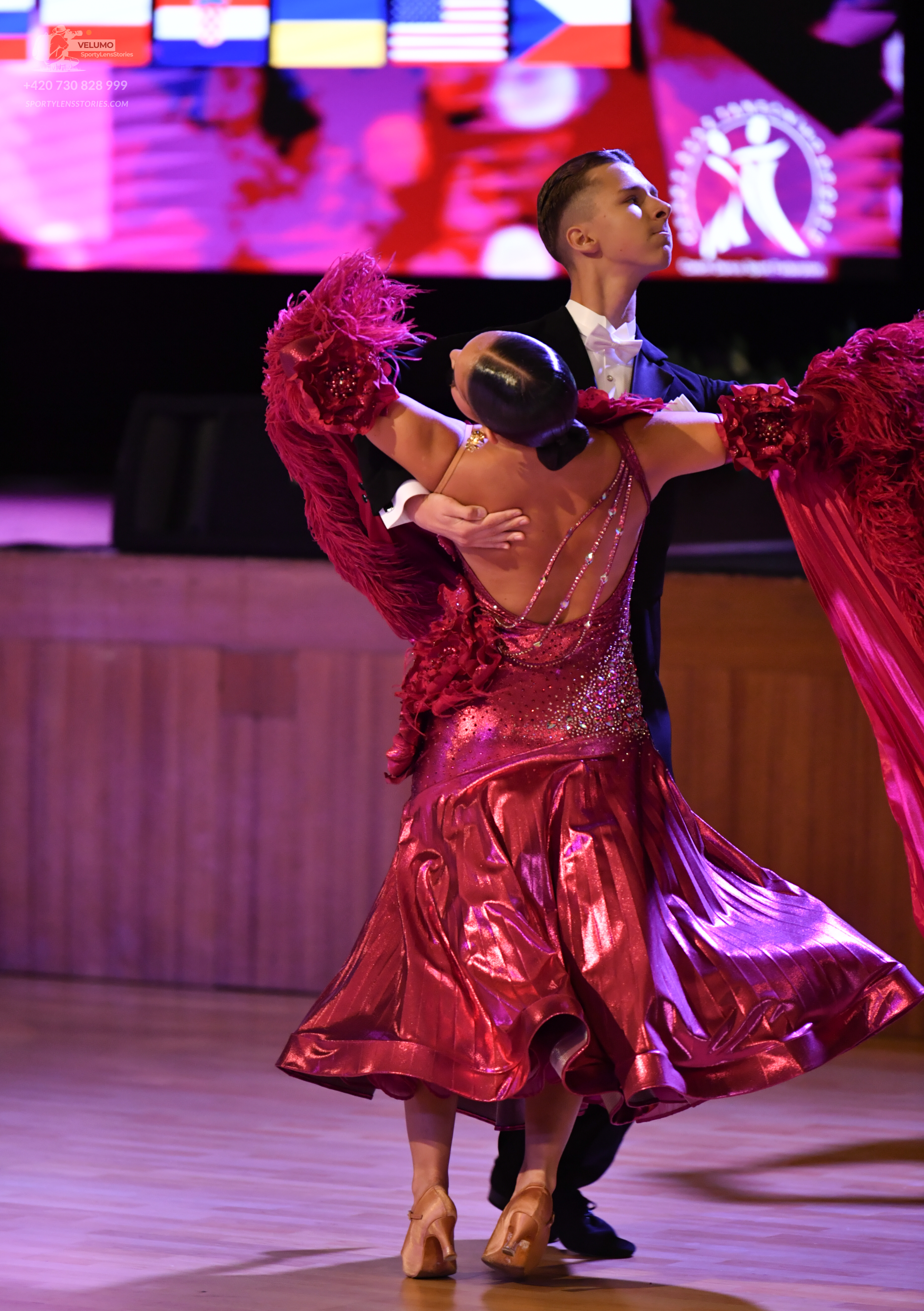 Dancesport competitor: Male:**  A black suit with a satin lapel and a long, flowing black tail