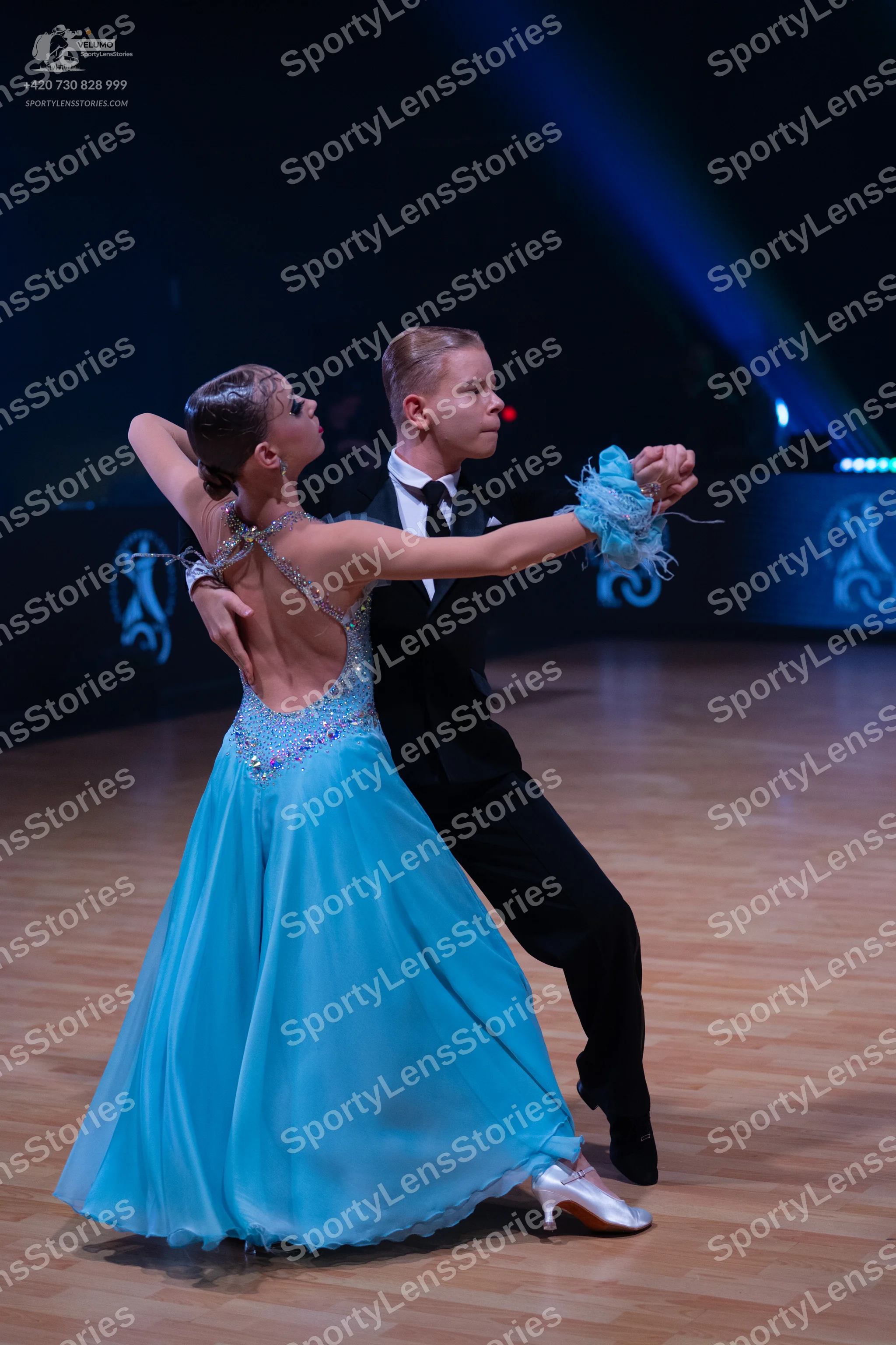 Dancesport competitor: Male dancer: black suit with a white shirt and black bow tie