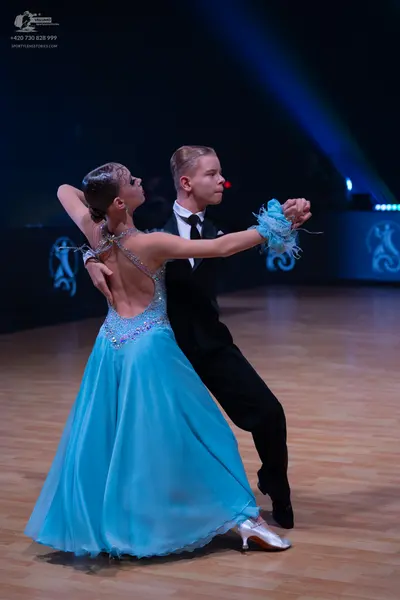 Dancesport competitor: Male dancer: black suit with a white shirt and black bow tie