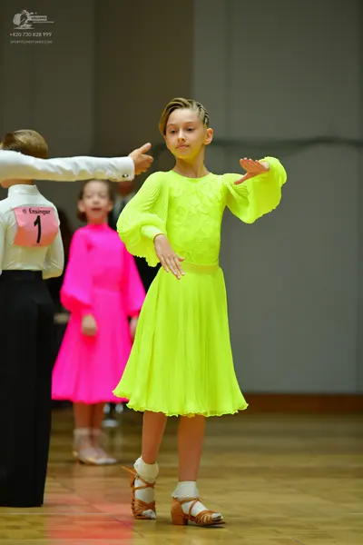Dancesport competitor: Male dancer: white long-sleeved shirt and black trousers