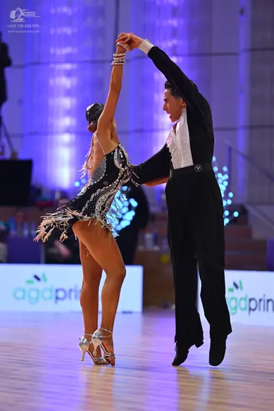 Dancesport competitor: Male dancer: black suit