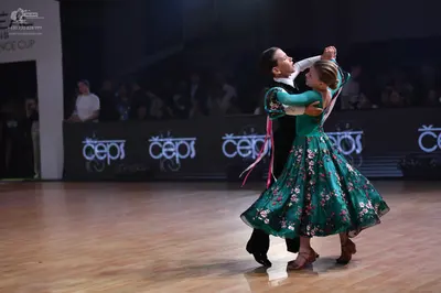 Dancesport competitor: Male dancer: black suit with a white shirt