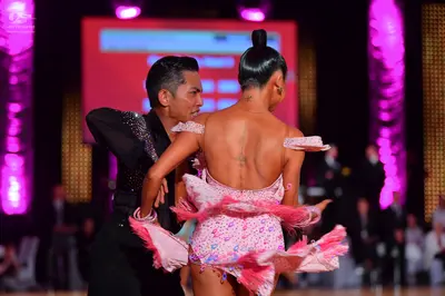 Dancesport competitor: Male dancer: black long-sleeved dance shirt with subtle shimmering details