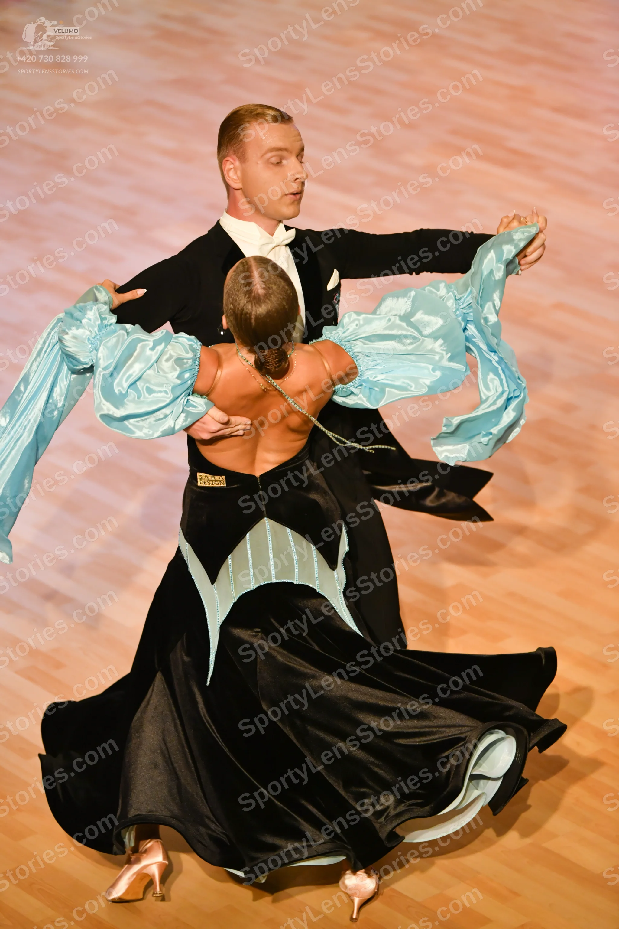 Dancesport competitor: ** Black tailsuit