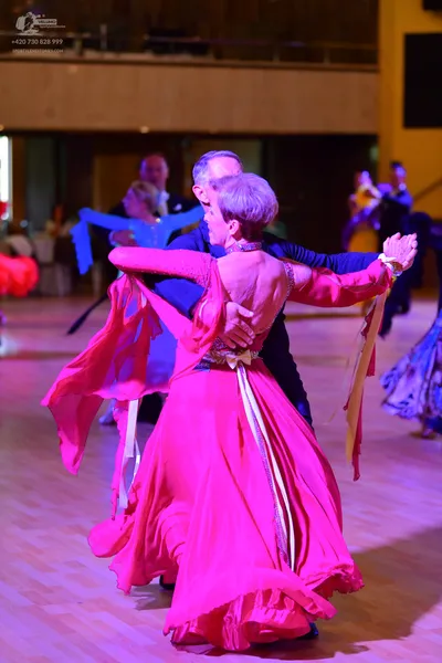 Dancesport competitor: ** Black tailsuit
*   **Fabric:** Appears to be a satin or similar smooth fabric