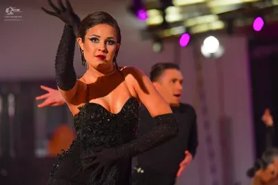 Dancesport competitor: Female dancer: black, strapless, sweetheart neckline dress with sequin or beaded