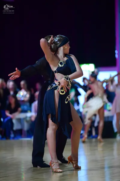 Dancesport competitor: Male dancer: black suit