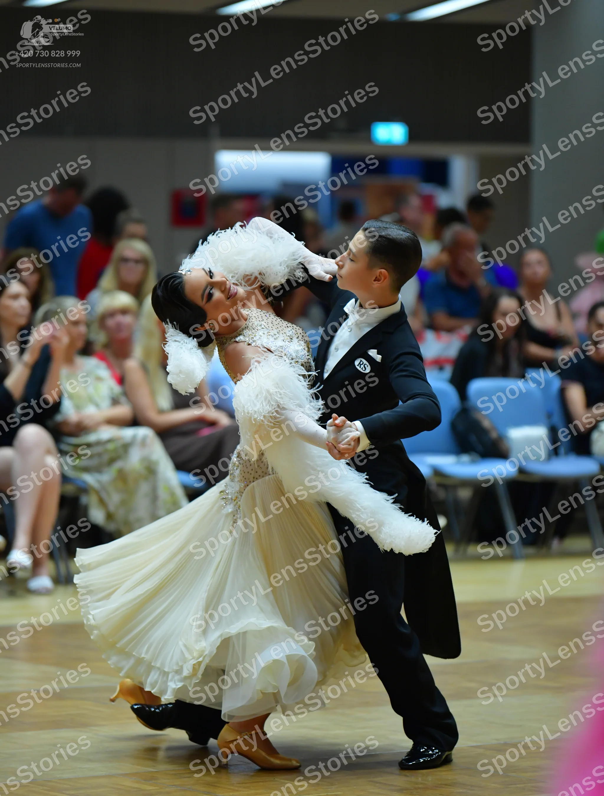 Dancesport competitor: Male dancer: black tailcoat suit with a white shirt and white waistcoat