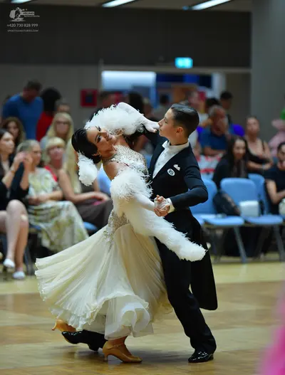 Dancesport competitor: Male dancer: black tailcoat suit with a white shirt and white waistcoat