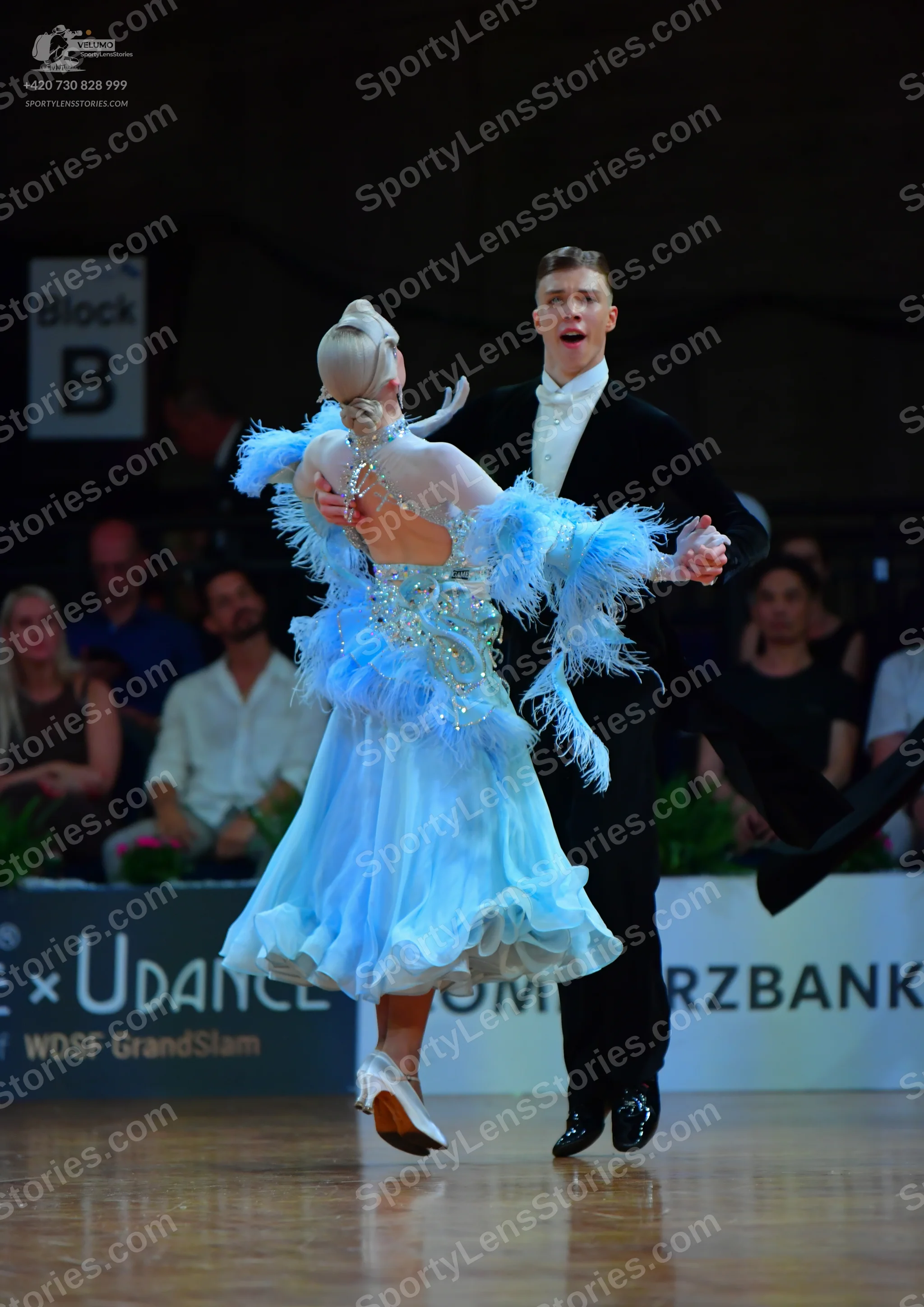 Dancesport competitor: Male dancer: black ballroom suit, white shirt, and white bow tie