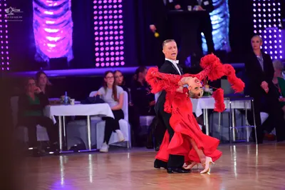 Dancesport competitor: Male dancer: black suit with white shirt and white bowtie