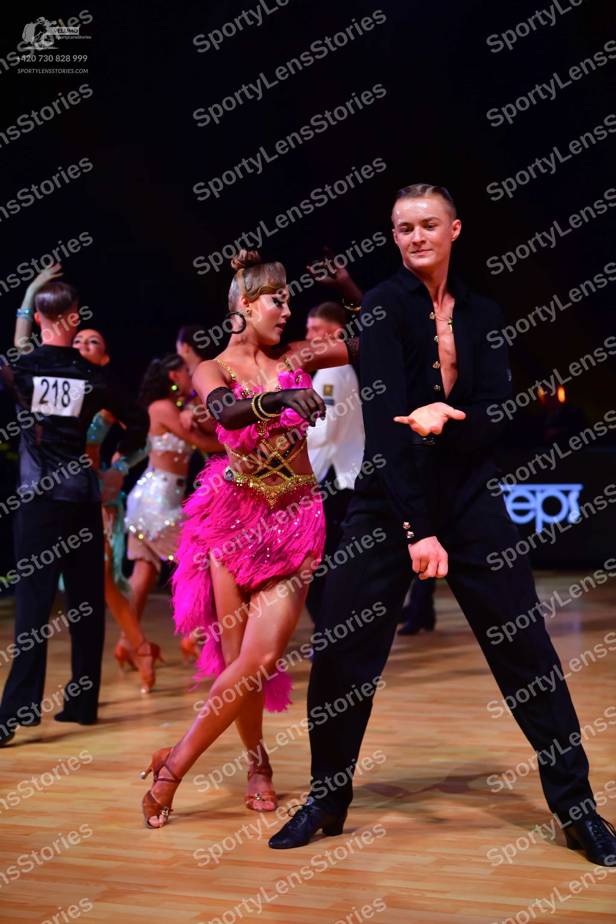 Dancesport competitor: Male dancer: black long-sleeved shirt with small crystals and black trousers