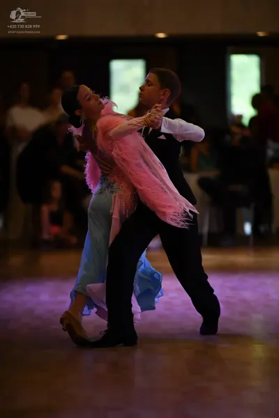 Dancesport competitor: ** Black tail suit