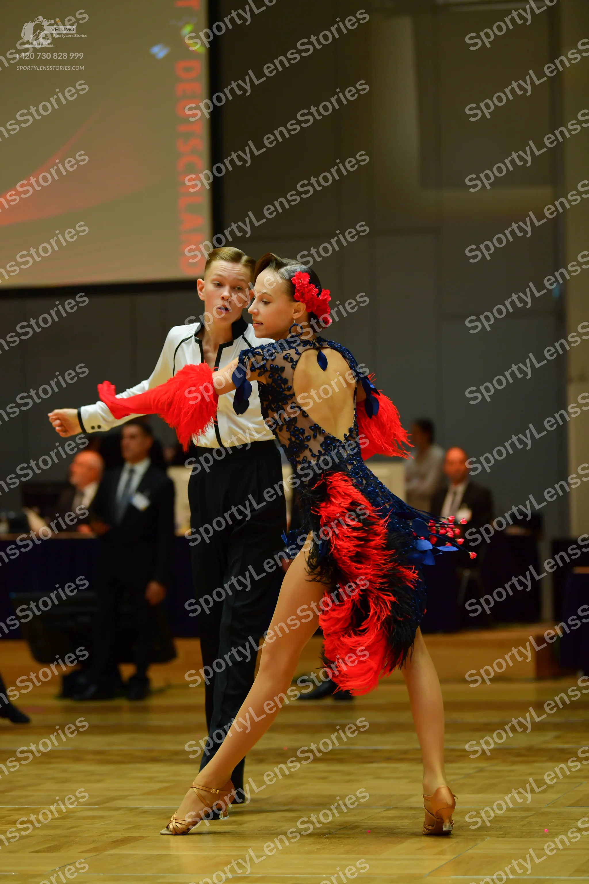 Dancesport competitor: Male dancer: white long-sleeved shirt and black trousers