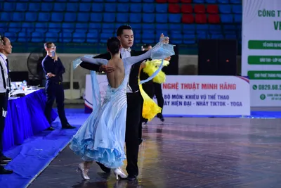 Dancesport competitor: **  Light Blue Ballroom Suit 
*   **Fabric:** Satin (appears to be a light blue 