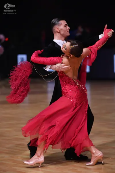 Dancesport competitor: Male dancer: black suit with a white shirt