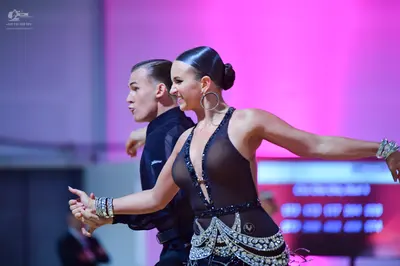 Dancesport competitor: Male dancer: black long-sleeved shirt