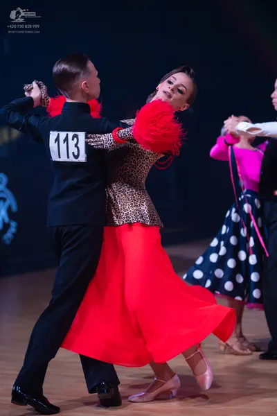 Dancesport competitor: Male dancer: black suit
