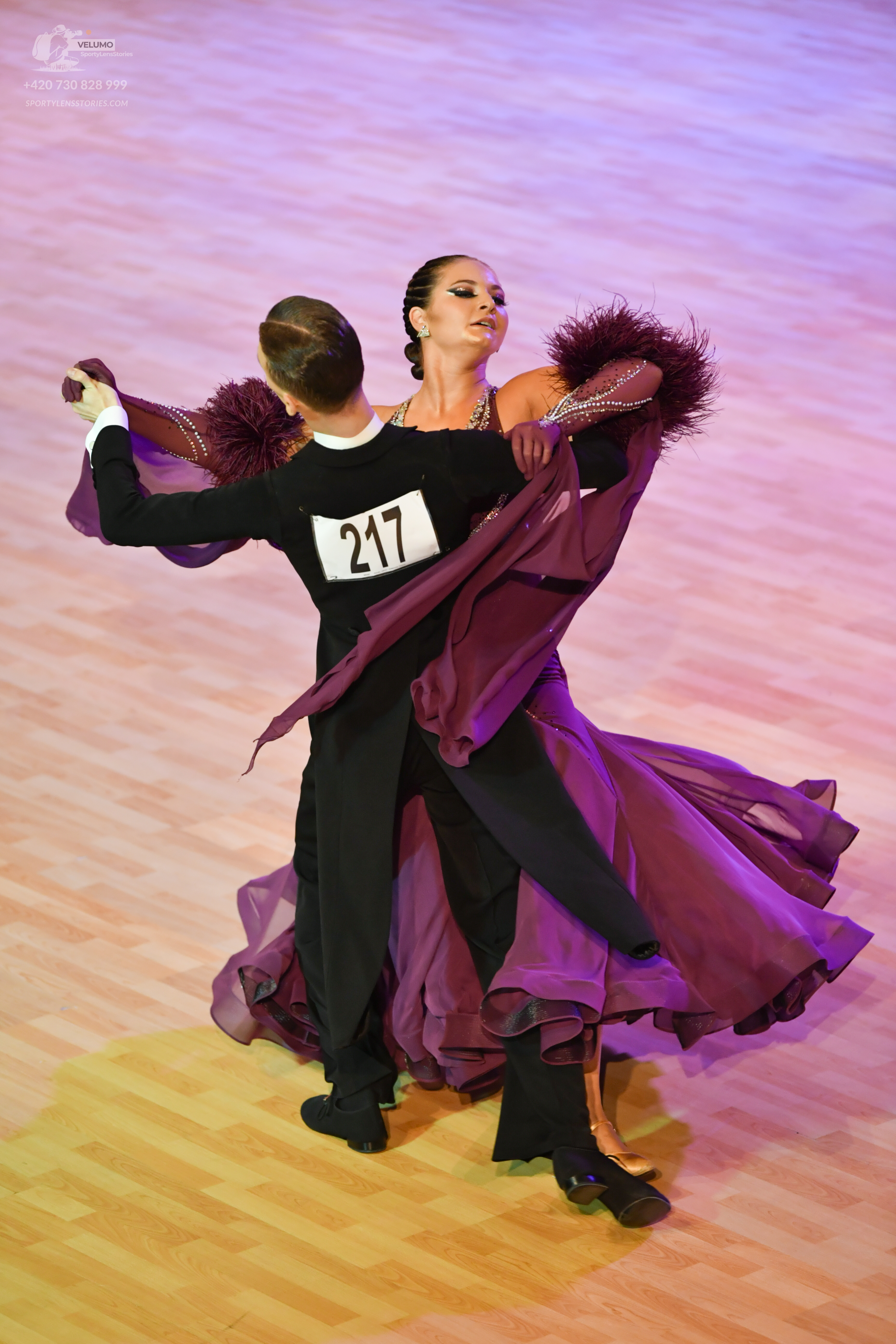 Dancesport competitor #217: Male**

*   **Color:** Black
*   **Fabric:** Tail suit material – likely satin o