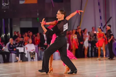 Dancesport competitor #451: Male dancer: black long-sleeved shirt and black trousers