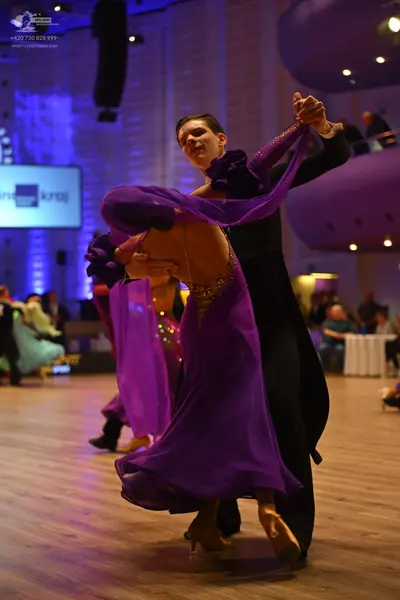 Dancesport competitor: Male dancer: black suit