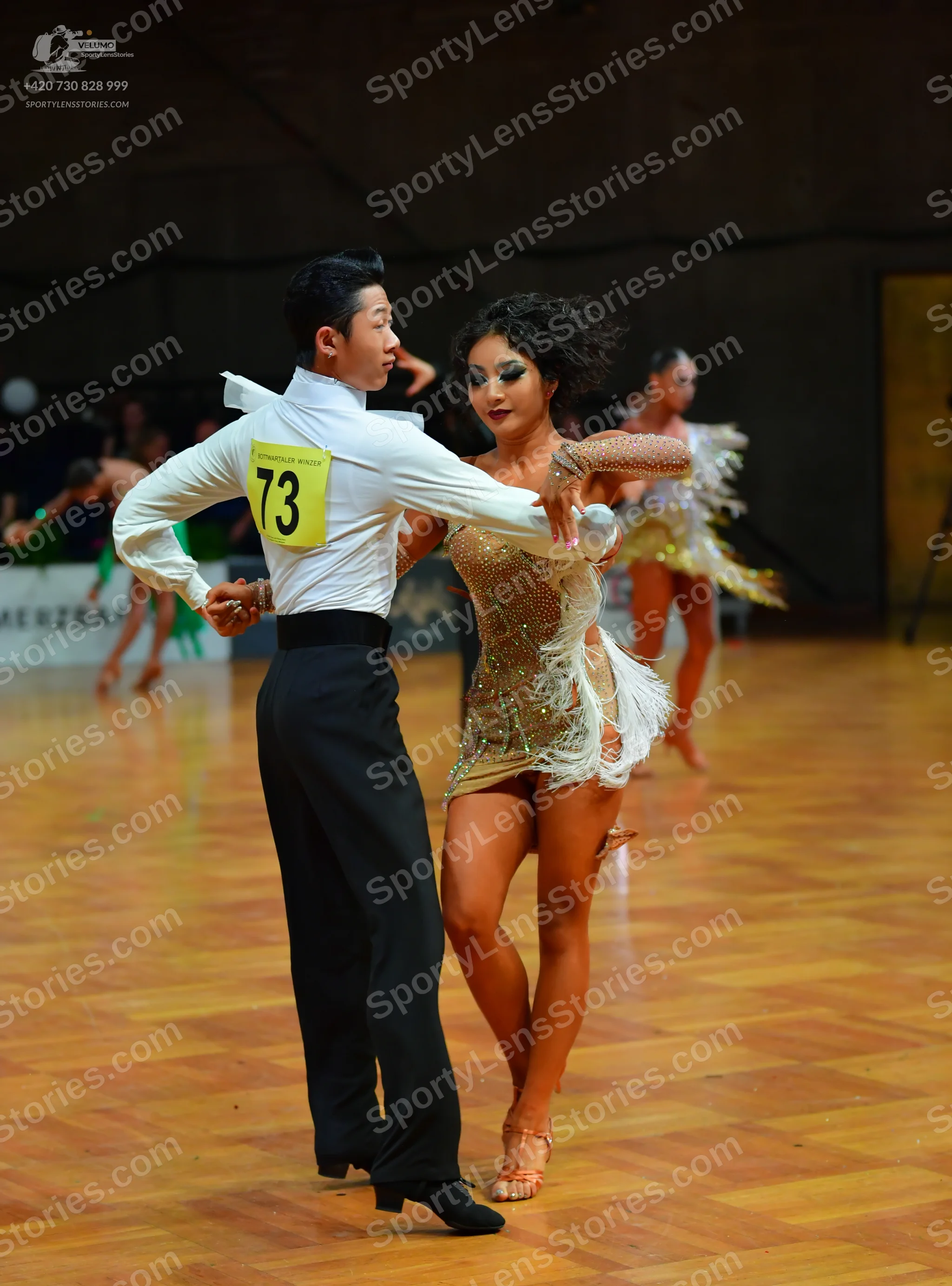 Dancesport competitor #73: Male dancer: white long-sleeved shirt and black trousers