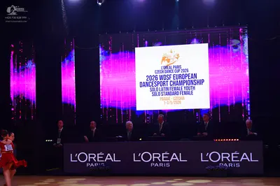 Dancesport competitor: Female dancer: red/orange Latin dress