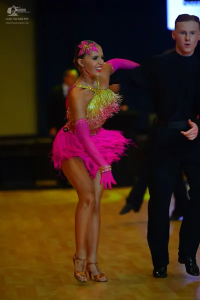 Dancesport competitor: Male dancer: black long-sleeve shirt and black trousers