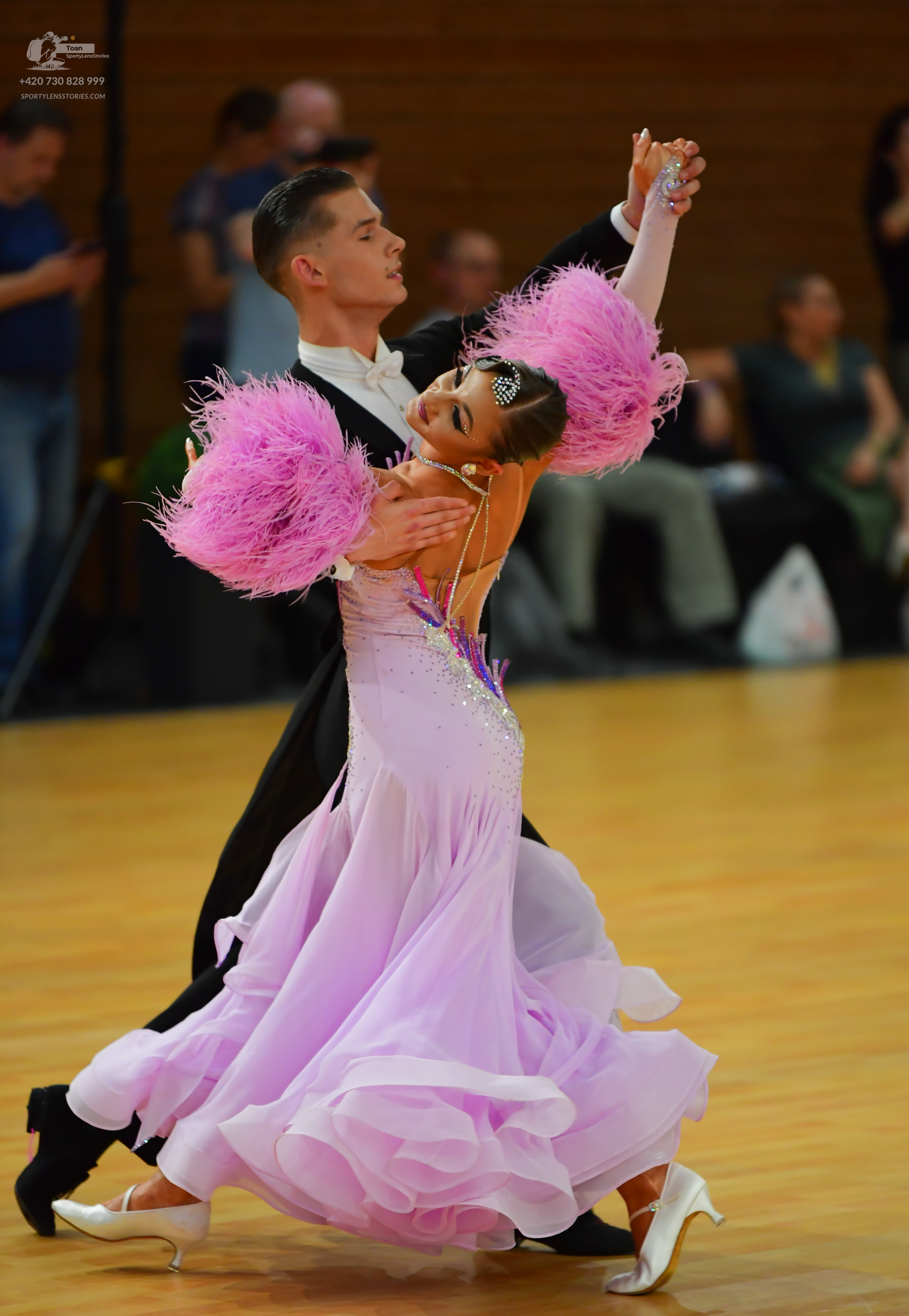 Dancesport competitor: ** Male: Charcoal grey tail suit with a white satin shirt, a black sequined lape