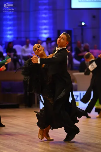 Dancesport competitor: Male dancer: black tailcoat, white shirt, and black trousers