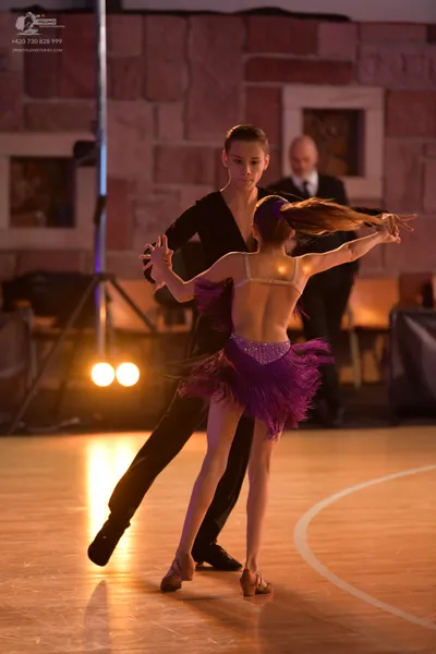 Dancesport competitor: Male dancer: black long-sleeved shirt and black trousers